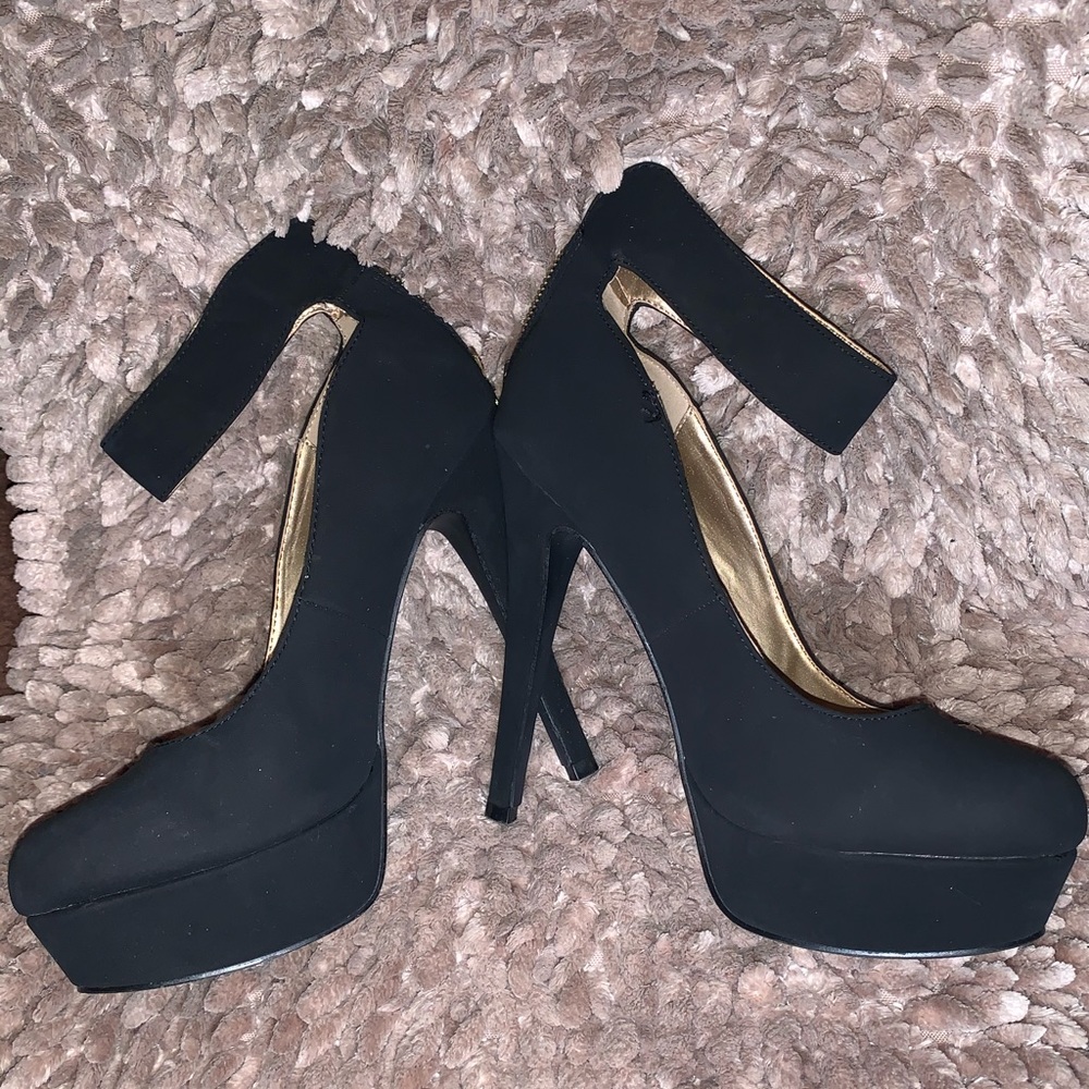 Woman’s black platform heel with ankle strap
